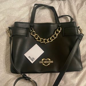 Medium size black Moschino handbag with gold hardware & red interior. Brand new!